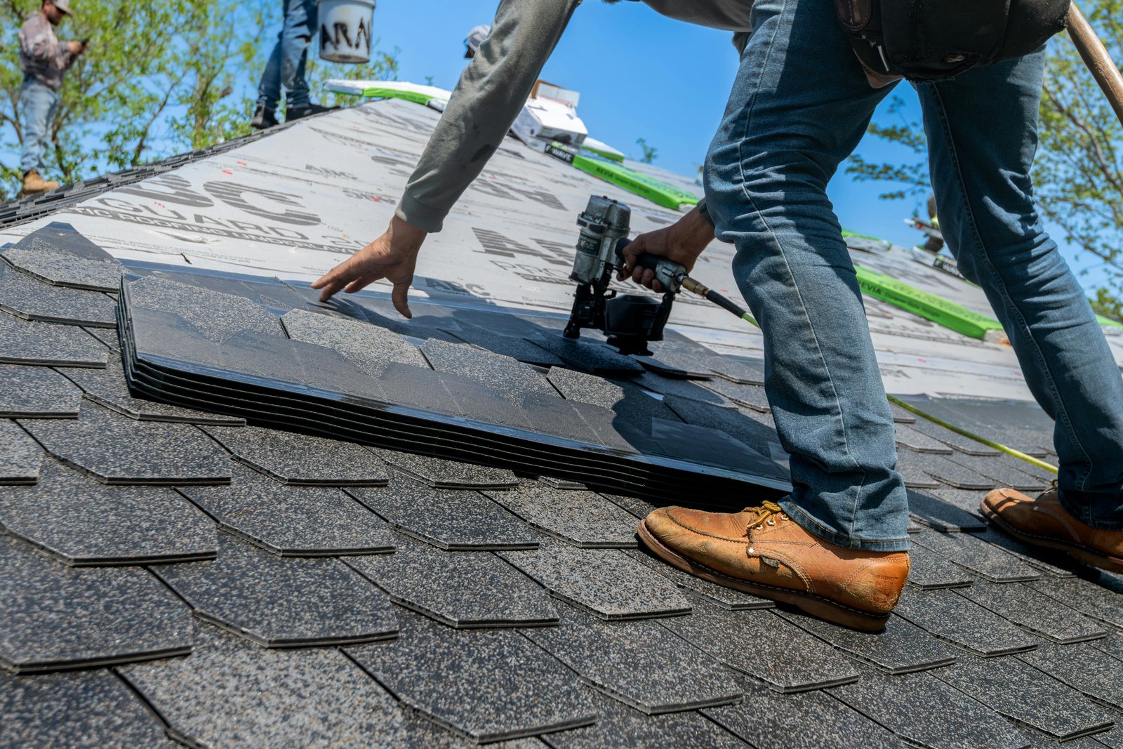 Licensed roofer installing architectural asphalt shingles in Wichita Kansas
