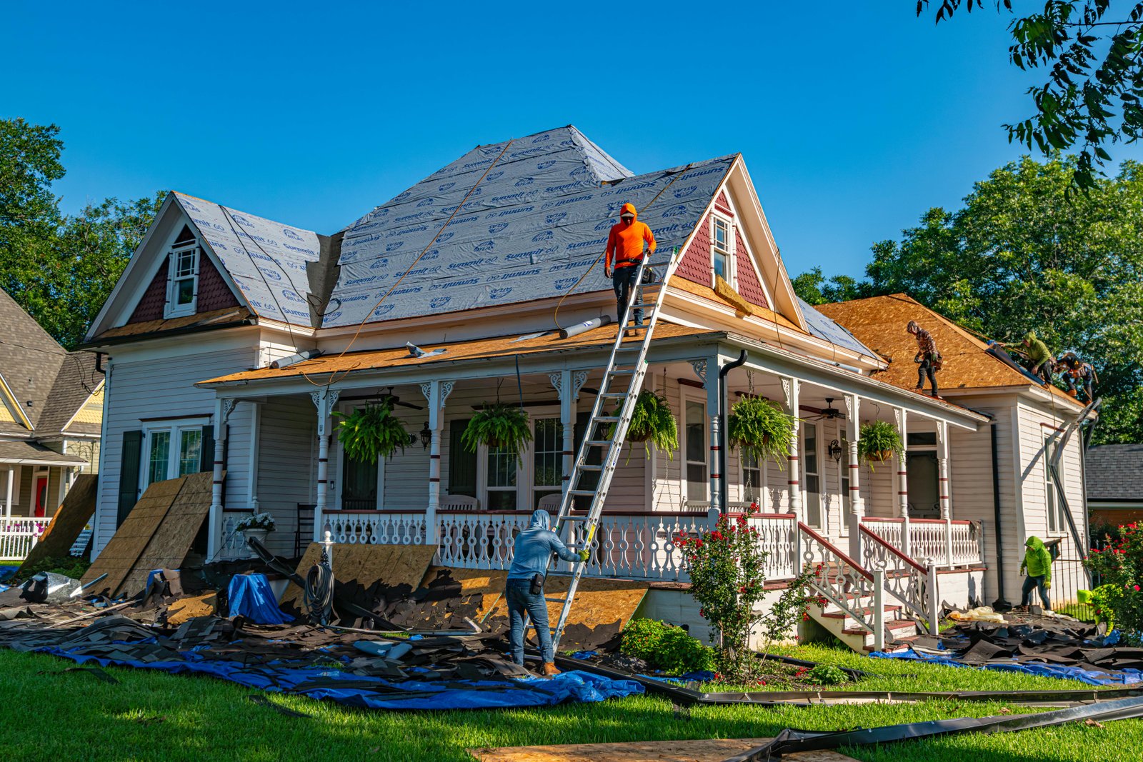 Roof Dr crew performing complete roof replacement on Wichita KS home